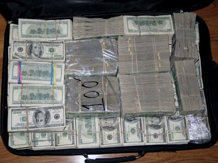 This case is filled with 100 dollar Bills estimated to be and additional 1/2 a million dollars