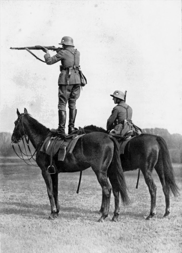 1935, German soldier takes while on the back of a trained horse 