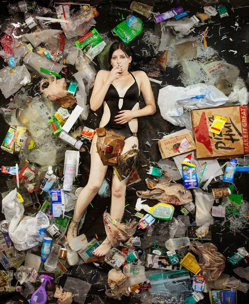 Photos Of People Lying In The Trash They Produce In A Week