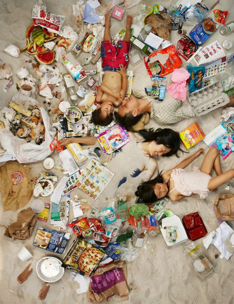 Photos Of People Lying In The Trash They Produce In A Week
