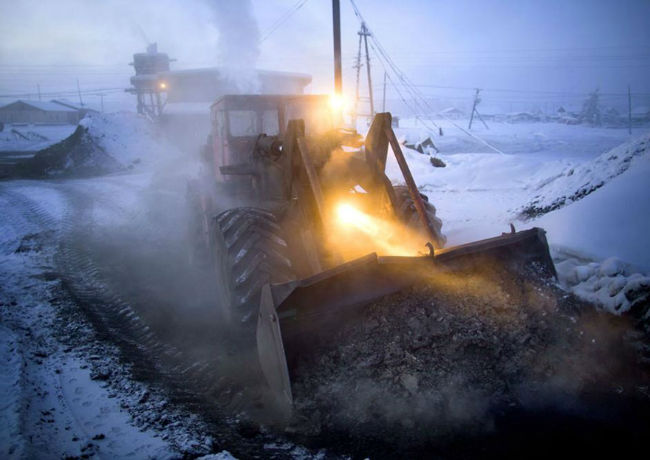 A snow plow clears a road in Oymyakon 