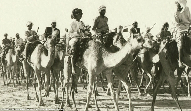 A camel caravan passing through the desert