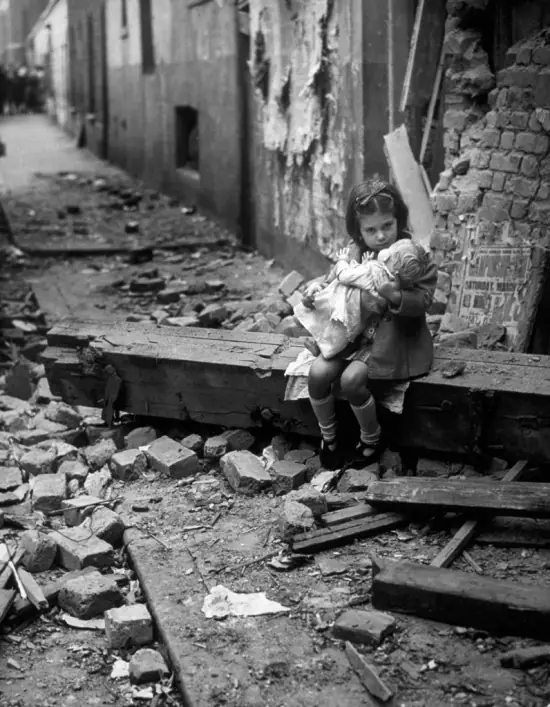 Little girl comforting her doll