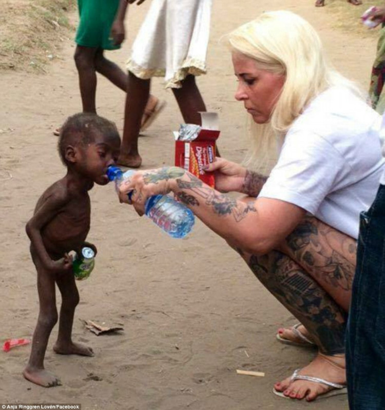 Nigerian boy is given water