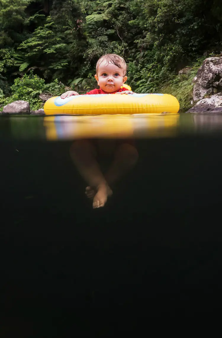 Baby above deep water