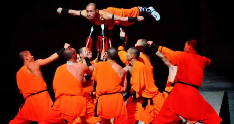 A Shaolin Monk suspending himself on spears