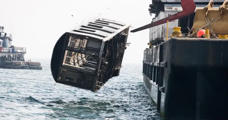 Subway cars being dumped into ocean