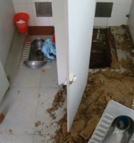 Picture In China baby survived by being accidentally flushed down the toilet.