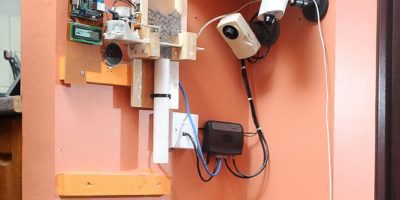 Picture Man Feed His Dog Using Twitter.