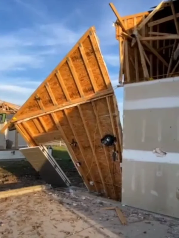 Collapsed wall from tornado destruction.