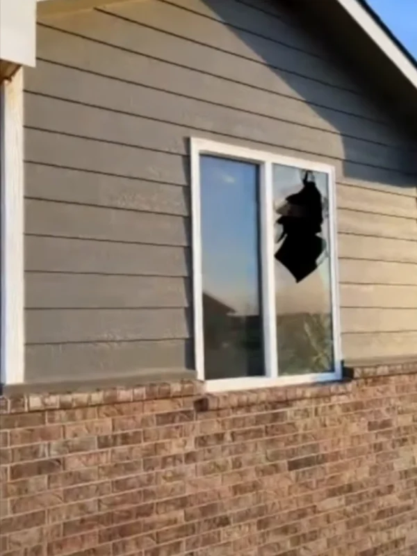 Shattered window from the tornado's impact.