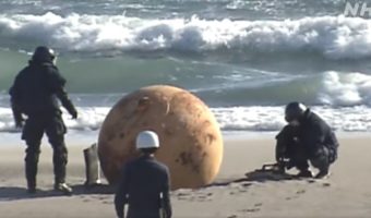 Picture Mysterious Metal Ball on Japan’s Pacific Shoreline Baffles Locals