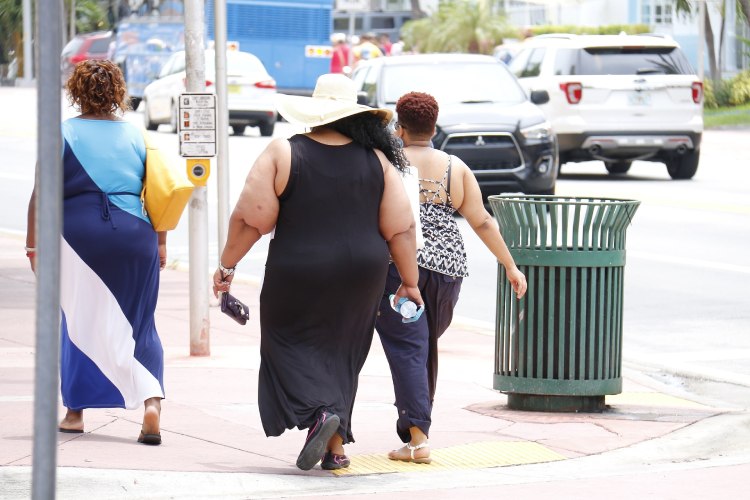 Obese adults walking on the streets of America