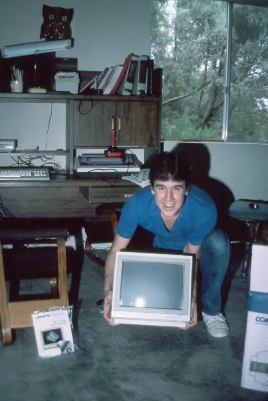 Terry with a computer monitor.