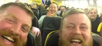 Picture Doppelganger Pair Find Themselves Seated Next to Each Other on a Ryanair Flight