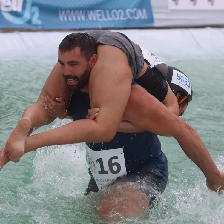 A man carrying his wife Wife Carrying World Championship