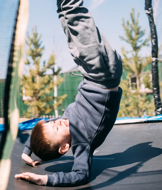 A child playing on a trampoline Trampolines
